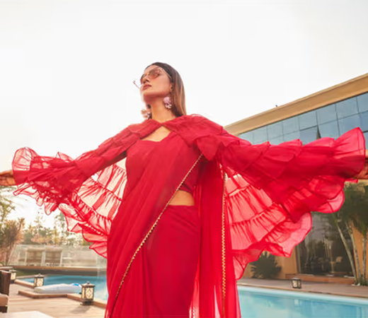 Pink Colored Polyester Georgette Saree with Ruffled Cape with Unstitched Blouse