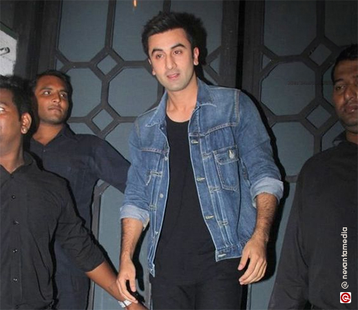 Ranbir Kapoor in a black t-shirt, jeans, and a blue denim jacket