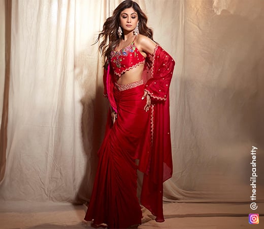 Shilpa Shetty in a bright red embellished blouse and pre-draped saree