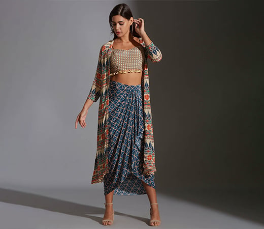 Bustier with tassel detail and dhoti drape skirt.