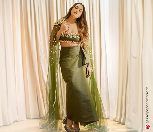 Sonakshi Sinha in a sage green fusion set with a cape