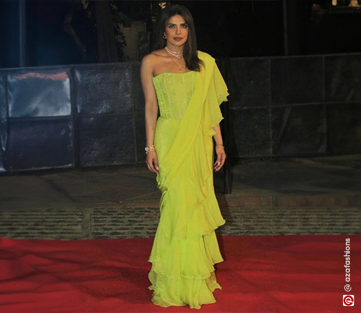 Priyanka Chopra in a lime green pre-draped saree with a corset blouse