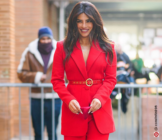 Priyanka Chopra wearing a red jacket and trousers