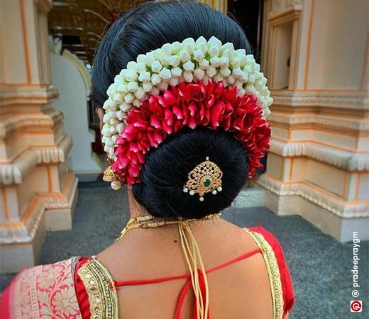 Woman in ethnic attire and bun pin hairstyle