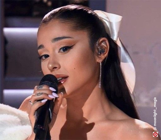 Ariana Grande’s hair updo with a satin bow