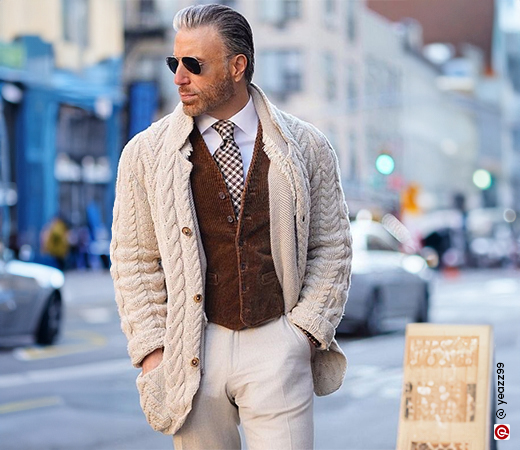 Man wearing sweater with shirt and tie