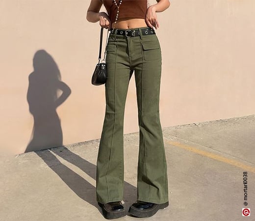 Woman wearing green bootcut pants