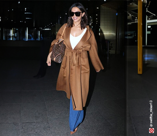 Deepika Padukone wearing a brown trench coat 