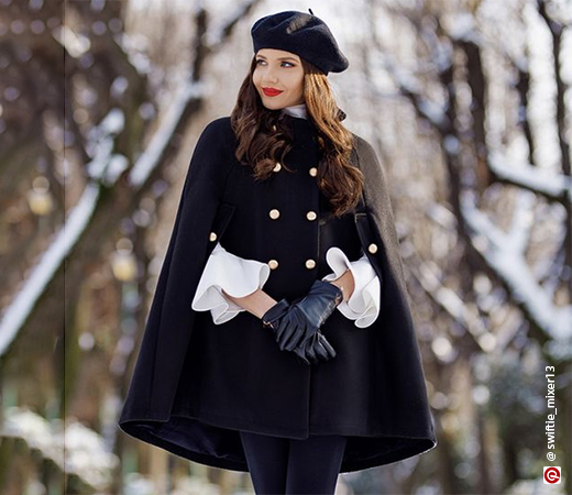 Woman wearing a black cape