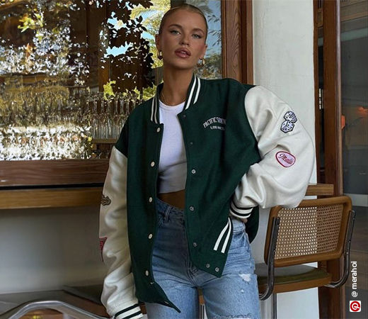 Woman wearing varsity jacket