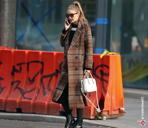 Gigi Hadid wearing brown chequered winter coat