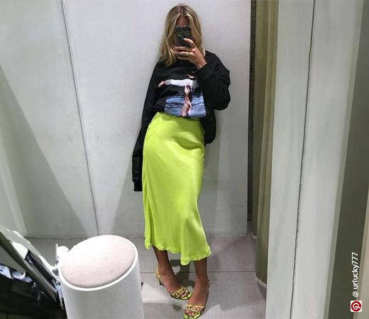  Woman wearing a graphic t-shirt with a midi skirt