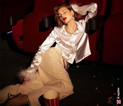 Woman wearing satin shirt and trousers 