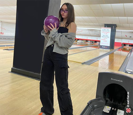 Women wearing chequered shirt and black pants