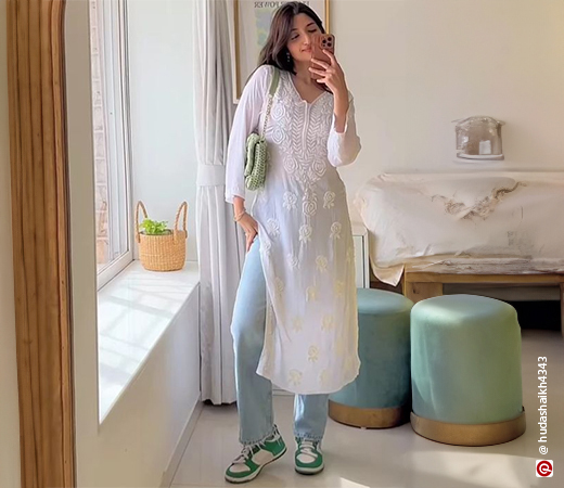 Woman wearing white kurta and jeans