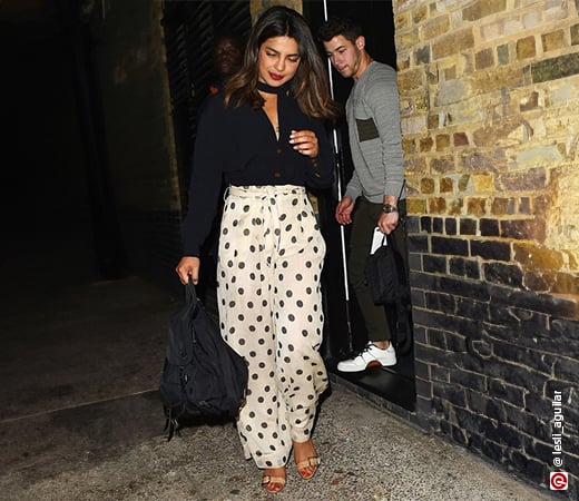 Priyanka Chopra in black top and polka dot trousers