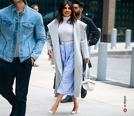Priyanka Chopra wearing pastel coat and skirt with boots