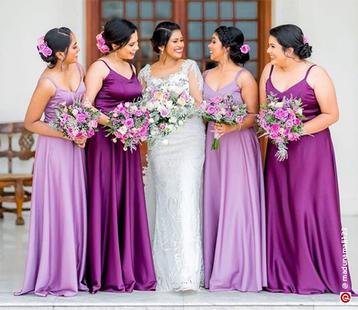 Women wearing purple gowns