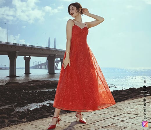 Aditi Dot wearing a red embroidered maxi dress