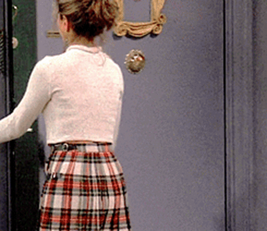 Woman in graphic tee and leopard print skirt
                                                                                                                                