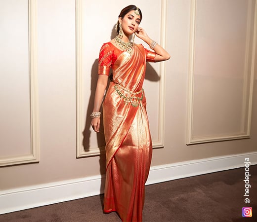 Pooja Hegde wearing a red saree