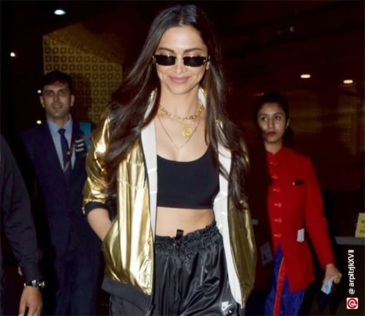 Deepika Padukone wearing a gold-toned jacket with track pants