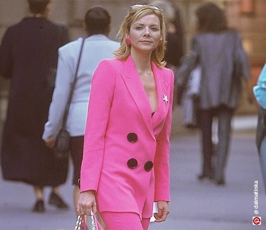 Kim Cattrall wearing a hot pink blazer set