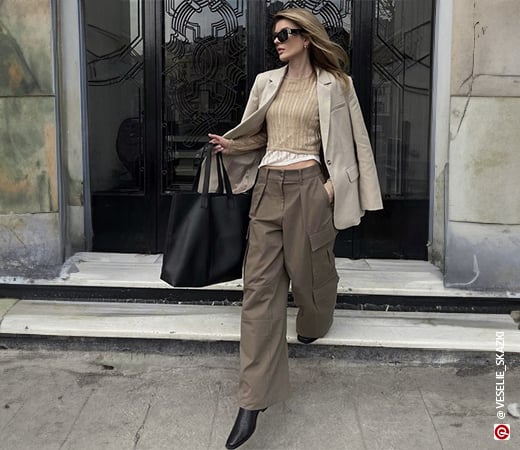 Woman wearing brown cargos with a beige blazer.