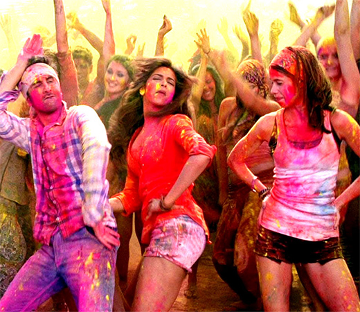 Deepika Padukone wearing a red shirt and white shorts