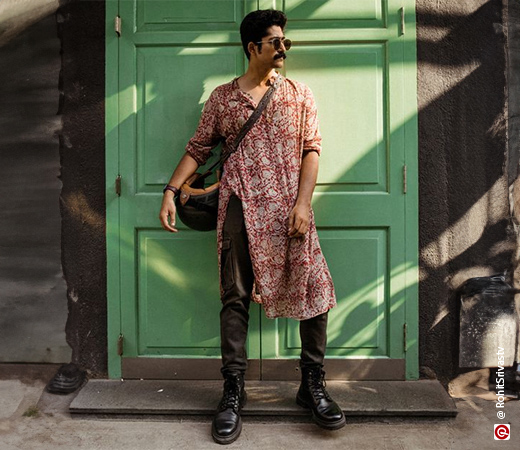 Man wearing a red cotton printed kurta with cargo pants and black combat boots