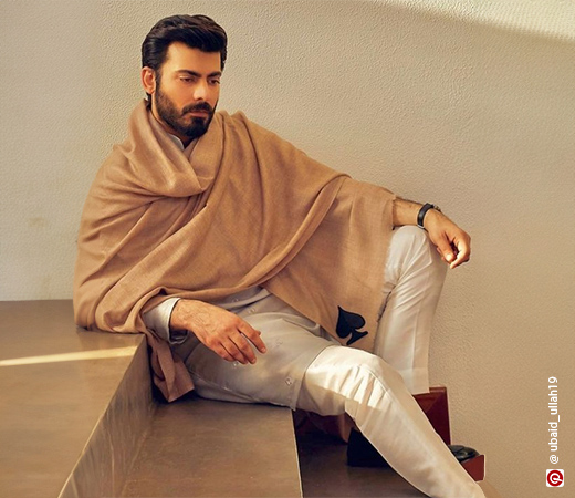 Fawad Khan wearing a beige kurta and pajama with a shawl