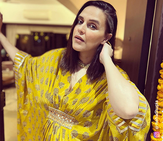 Neha Dhupia wearing a yellow printed kaftan