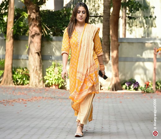 Sara Ali Khan wearing a yellow kurta set with trousers