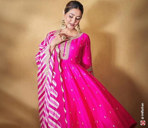 Hina Khan wearing an Anarkali suit with a striped dupatta