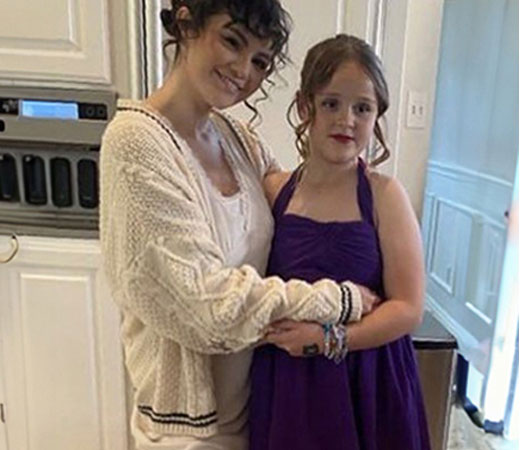 Selena Gomez wearing a cardigan