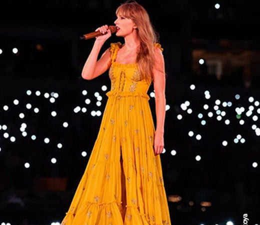 Taylor Swift wearing a yellow dress