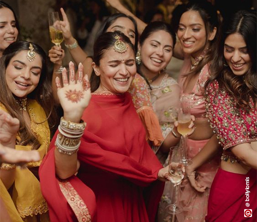 Alia Bhatt wearing a red anarkali suit