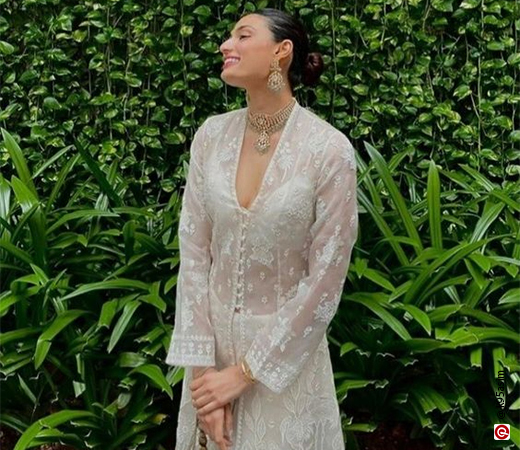 Athiya Shetty wearing a sheer white jacket and kurta