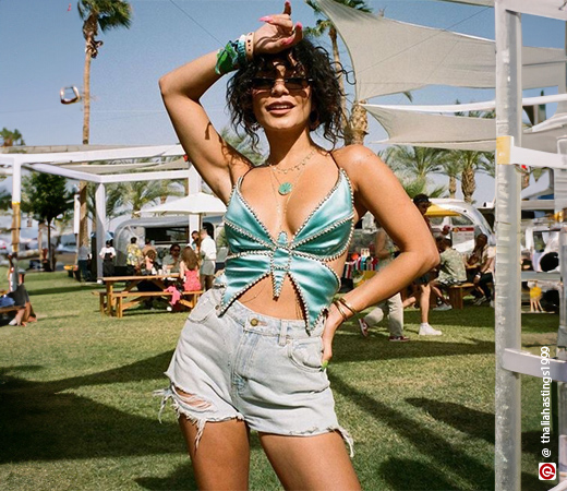 Vanessa Hudgens wearing a butterfly top with shorts