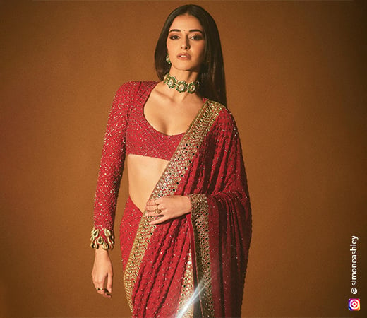 Ananya Panday wearing a red saree 