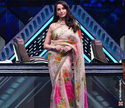 Nora Fatehi wearing a floral organza saree