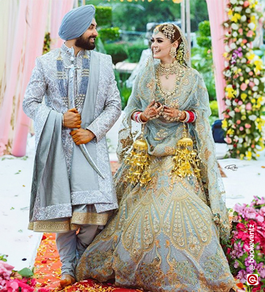 the bride groom wearing blue
